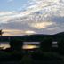 Sunset river view at Bailey House, Annapolis Royal, with trees and calm water reflections