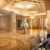 Guanyuan Liusu Hotel Suzhou lobby with chandeliers, polished marble floor and floral arrangements