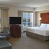 Residence Inn by Marriott Kingston Water's Edge room with water view, sofa, chair and TV in Kingston