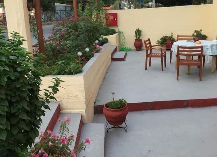 Akanthos Hotel in Ierissós with outdoor seating beside a garden terrace