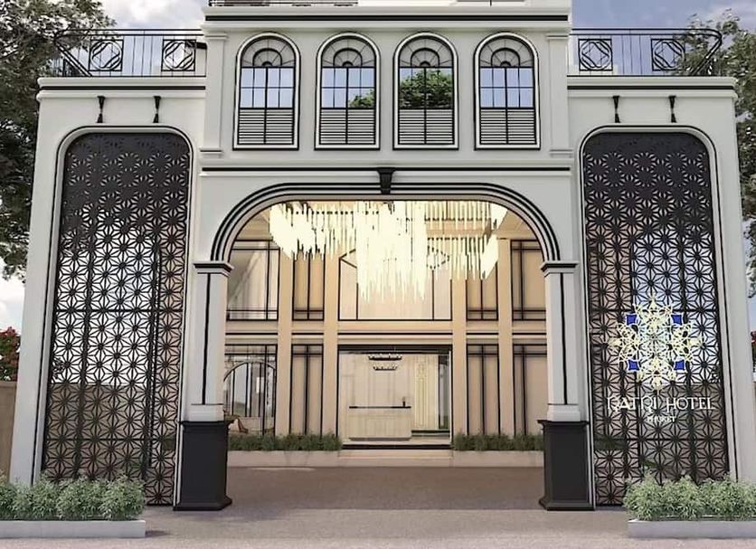 Ratri Hotel Phuket Old Town in Phuket City, elegant arched entrance with tall decorative screens
