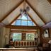 Villa Silvina Hotel And Restaurant in Baguio living area with vaulted wood ceiling and large triangular window
