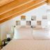 Alla Torre Del Barbarossa B&b Foresteria in Mandello del Lario bedroom with wooden ceiling and bed