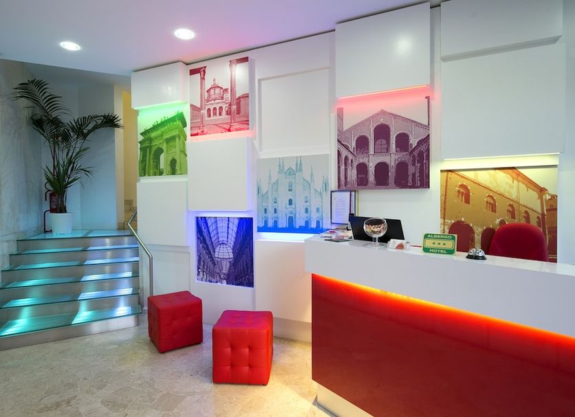 Hotel Milano Navigli lobby in Milan with colorful lit reception desk and wall art