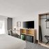 Spark by Hilton Toronto Markham guest room with bed, TV, desk, wardrobe, and window view