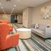 Holiday Inn Metairie New Orleans By IHG lobby seating area with sofa, chairs and round table