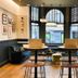 ibis Styles London Gloucester Road lobby with arched window seating and bar area in London