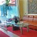 A25 Hotel Mai Hac De in Hanoi lobby with orange sofa, glass table and red carpet