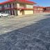 Budgetlodge in Oklahoma City exterior with red-roofed motel-style rooms and parking lot