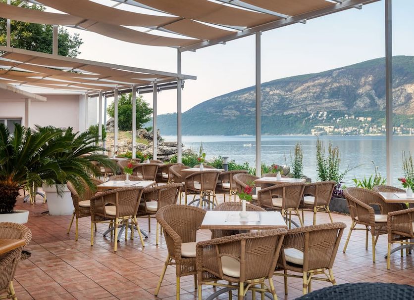 Hunguest Hotel Sun Resort in Herceg Novi outdoor terrace dining with sea and mountain views