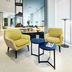 Sercotel Madrid Aeropuerto lobby seating area with yellow chairs and blue tables in Madrid