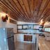 Mai Pen Rai Bungalows in Ko Pha Ngan: rustic kitchen with wooden ceiling, tiled floor, and counter space