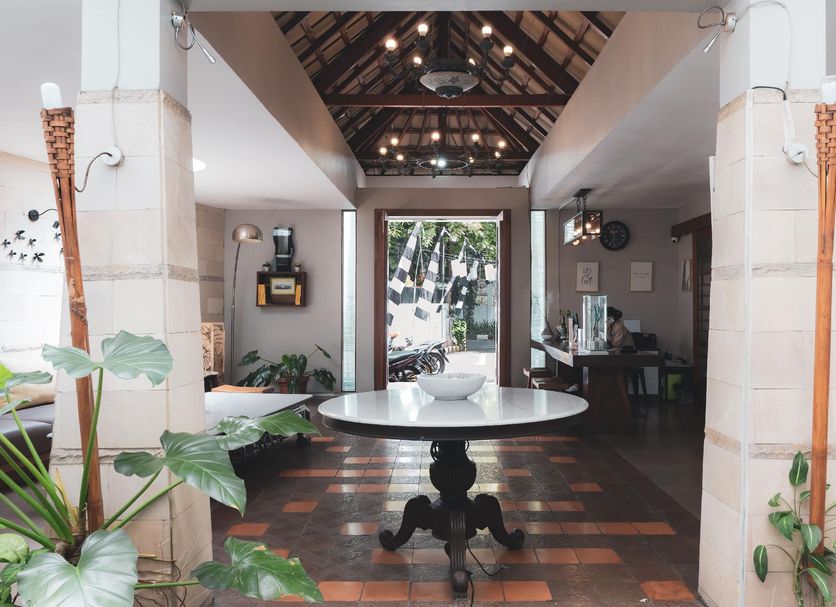 Hotel Tibera Taman Cibeunying lobby with round table, high ceiling, and courtyard view in Bandung