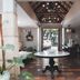 Hotel Tibera Taman Cibeunying lobby with round table, high ceiling, and courtyard view in Bandung
