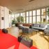 HC Resort, Lignano Sabbiadoro lobby with red carpet, lounge seating and large windows