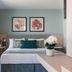123 Mainstreet Boutique Hotel in St. Julian's room with king bed, balcony doors and floral wall art
