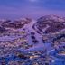Rauland Høgfjellshotell in Rauland with snowy mountain village lights at dusk