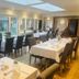 Little Silver Country Hotel in Tenterden dining room with set tables and large windows overlooking the garden