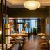 Hôtel Aoriste & Spa in Paris dining area with chandeliers, set tables, and floor-to-ceiling windows