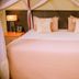 Heritage By Serendib, Blantyre guestroom with king bed, canopy drapes and bedside lamps