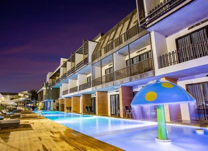 The Velo's Hotel And Bmx Pump Track in Aranyaprathet with illuminated outdoor pool and modern balcony rooms