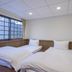 Guanwu Villa in Tai'an Township, twin beds beside a large window with mountain views