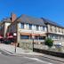 Hotel - Restaurant du Lac - Agen in Boé, stone hotel exterior beside a castle tower