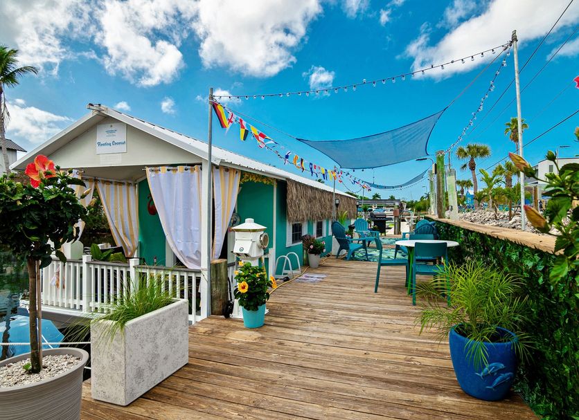 Latitude 26 Waterfront Resort & Marina in Fort Myers, colorful rooftop deck with marina and palm views