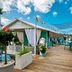 Latitude 26 Waterfront Resort & Marina in Fort Myers, colorful rooftop deck with marina and palm views