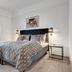 Hotel Hjallerup Kro bedroom in Hjallerup with a double bed, bedside lamps and window light.