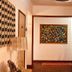 Boutique Hotel Casa Teatro hallway in Manaus with wall art, lamp, and stairway