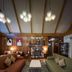 Villa Silvina Hotel And Restaurant in Baguio lounge with sofas, chandeliers, fireplace and patterned rug