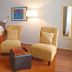 Summers Inn Ludington - Adults Only room with bed, two wicker chairs, and floor lamp in Ludington