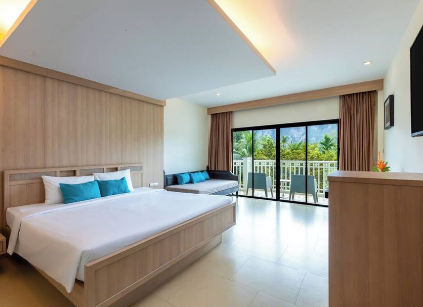 Krabi Tipa Resort in Krabi guest room with king bed, sofa bed and balcony view