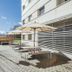 Residencia Universitaria Resa Los Abedules in Pamplona, outdoor terrace with picnic tables and umbrellas