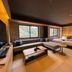 Hotel Obokekyo Mannaka in Miyoshi guest room with sofa bed, tatami flooring, and mountain-view windows