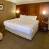 Comfort Inn Rutland - Killington guest room with king bed and armchair in Rutland