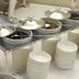 Hotel 4 Stagioni Sensus Spa in Bardolino breakfast buffet with bowls, lidded dishes and stacked white plates