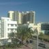 Ocean Beach Hotel in Miami Beach with palm trees, street view and high-rise buildings