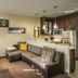Residence Inn by Marriott Savannah Airport suite with sofa, desk, kitchen island and stainless steel fridge