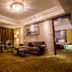 Changchun Huatian Hotel in Changchun lounge with sofa, chairs, chandelier and patterned carpet