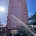 Sakai Sun Hotel Ishizugawa in Sakai, tall pink hotel building with sunlit facade