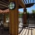 Hampton Inn & Suites Phoenix Chandler-Fashion Center patio with tables, chairs, and pergola shade in Chandler