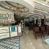 Balkan Palace Edirne lobby with seating area, chandelier, and glass coffee tables in Edirne