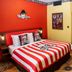 Legoland Hotel Dubai themed pirate room with striped bed, colorful decor, and hallway view in Dubai