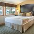 Worldmark Deer Harbor guest room with king bed, windows, and water view in Deer Harbor