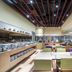 The Mulian Hotel Guangzhou Zhujiang New Town dining area with buffet counters and modern seating in Guangzhou