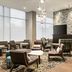 Residence Inn By Marriott New York Jfk Airport in Queens lobby seating area with fireplace and large windows