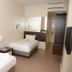 101 Hotel Bintulu in Bintulu: compact twin room with two single beds and wall-mounted TV