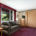 The Kimball at Temple Square hotel room with sofa, window view, lamps, and wood wardrobe in Salt Lake City